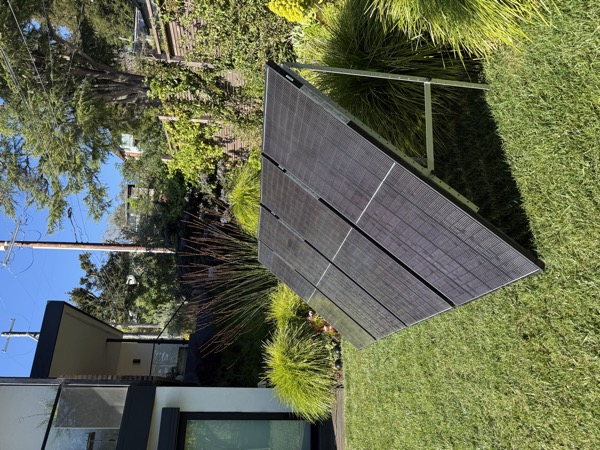 NEM GO plug-in solar kit — 4 panels on a backyard lawn